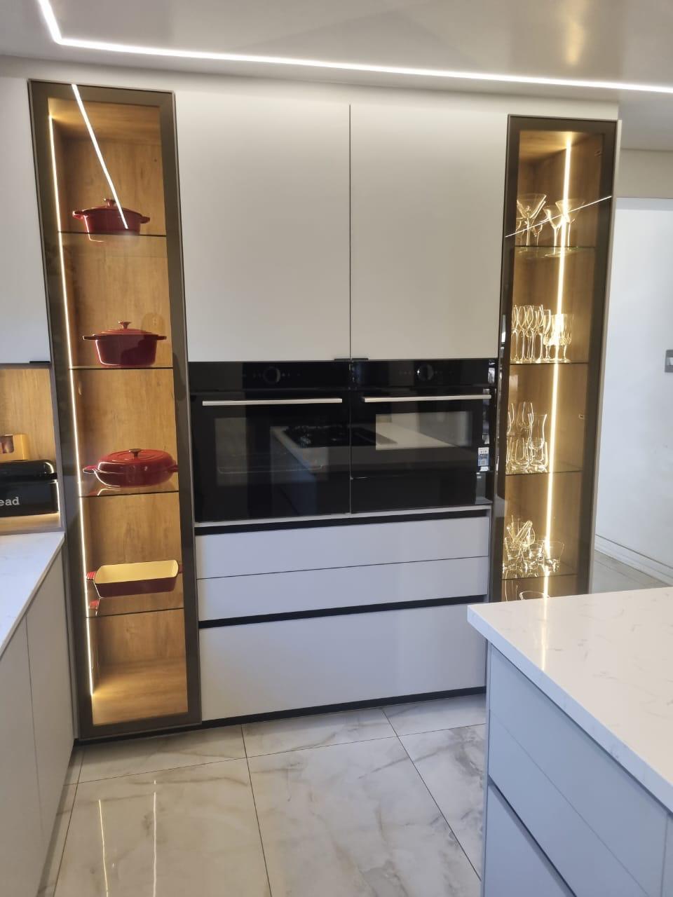 Backlit Oak Display Towers with Bronze Glass