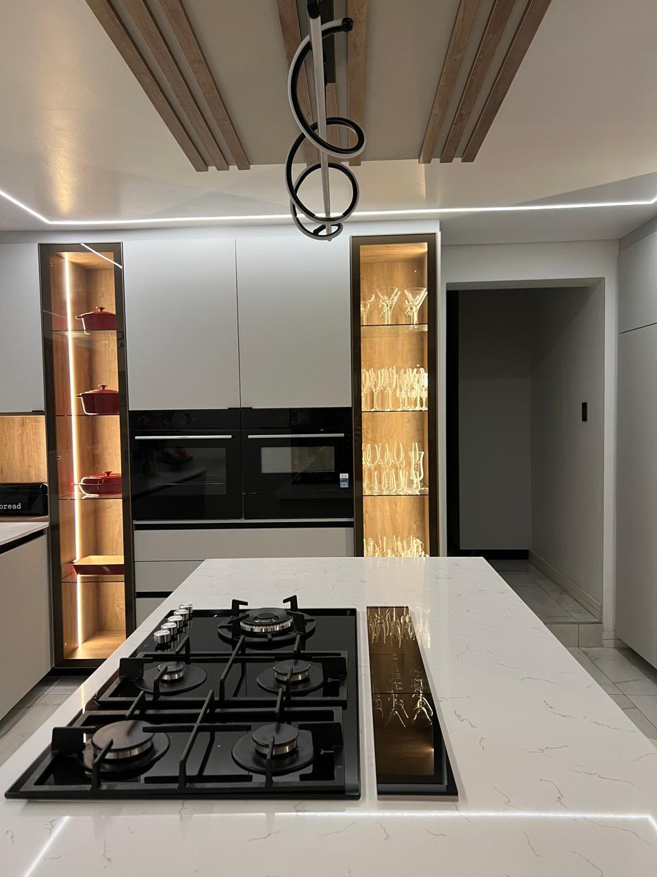 Island Kitchen with Backlit Display Towers