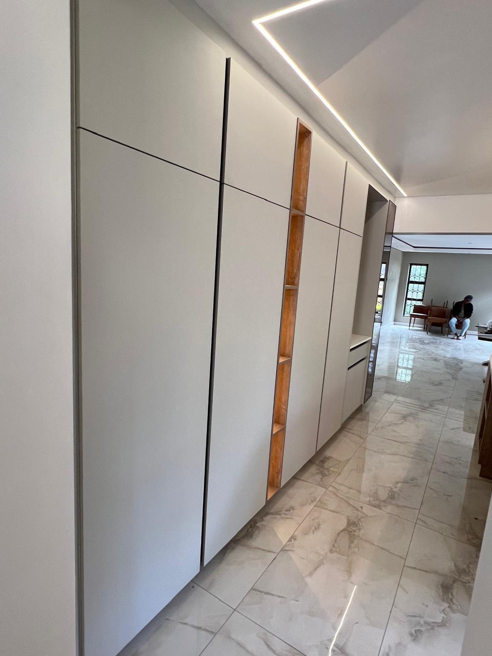 Floor-to-Ceiling Hall Storage with Oak Insert