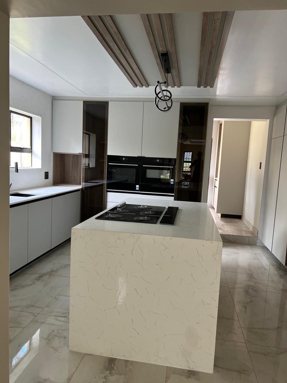 Handleless Kitchen with Timber Ceiling Beams