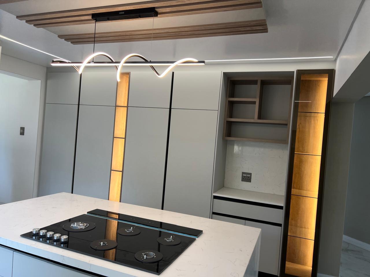 Handleless Cabinetry with Oak Light Channel